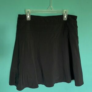 Athleta black athletic tennis shirt, built in shorts, size 4! In great condition